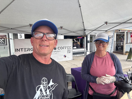 Joe pouring coffee at the Intergalactic Coffee Roasters farmers market booth
